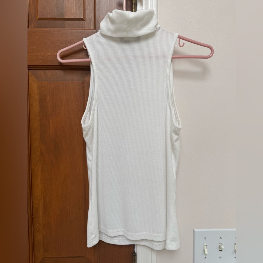 White ribbed knit sleeveless turtleneck top by SHEIN.